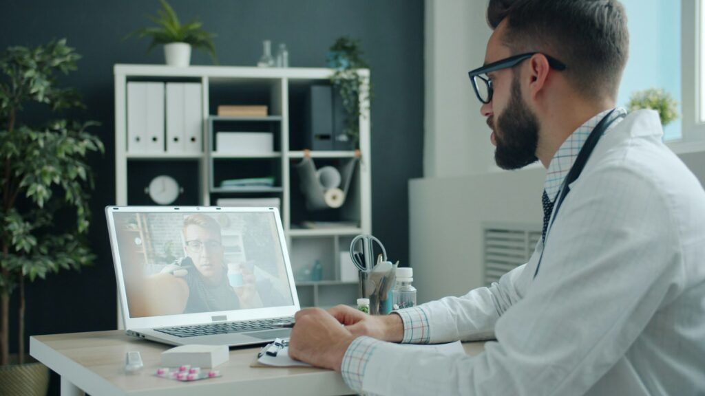 Doctor speaking with a patient during an online consultation